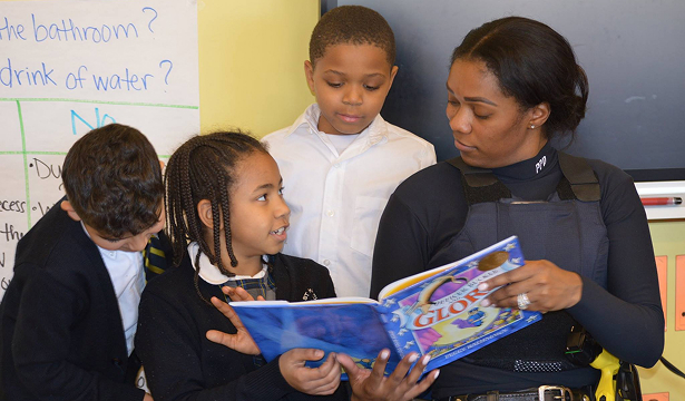 Teacher reading to classroom students