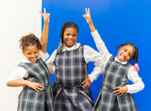 Three Students happily smiling