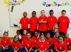 St Malachy group of students in classroom wearing red t-shirts