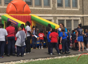 St Malachy school event located outside with inflatable equipment