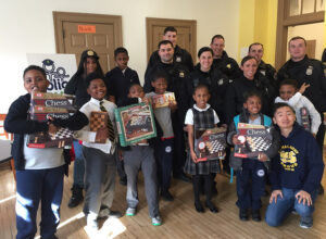 Students, Faculty, and Volunteers posing for a picture with local police