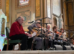 People playing music inside of cathedral