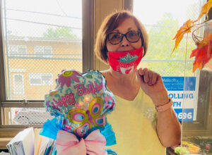 St Malachy faculty celebrating birthday with gifts
