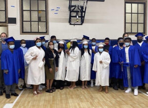 St Malachy graduating students standing in school gymnasium